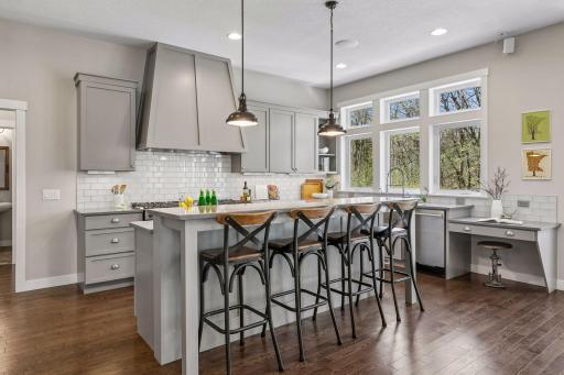 Gourmet style kitchen with all the bells & whistles! Quartz counters, double ovens / gas ranges, professional grade appliances & more!