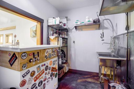 This brew room is where the creation begins. The kegerator / keezer is excluded from the sale. If brewing is not your thing, this could easily be converted to a kitchenette.