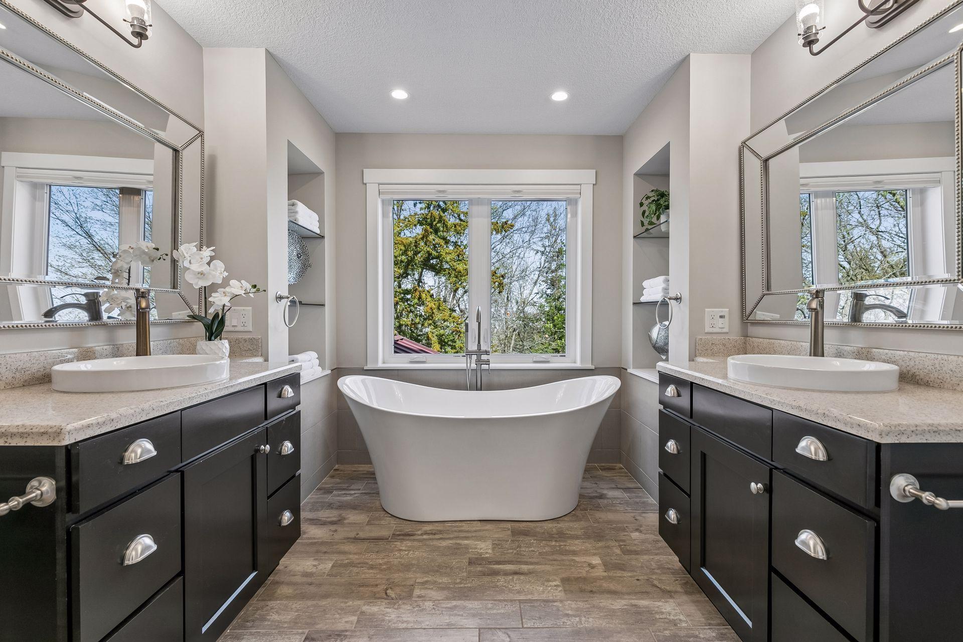 A spa-like ensuite bathroom with dual vanities, soaker tub, shower & even toe kick nightlights!