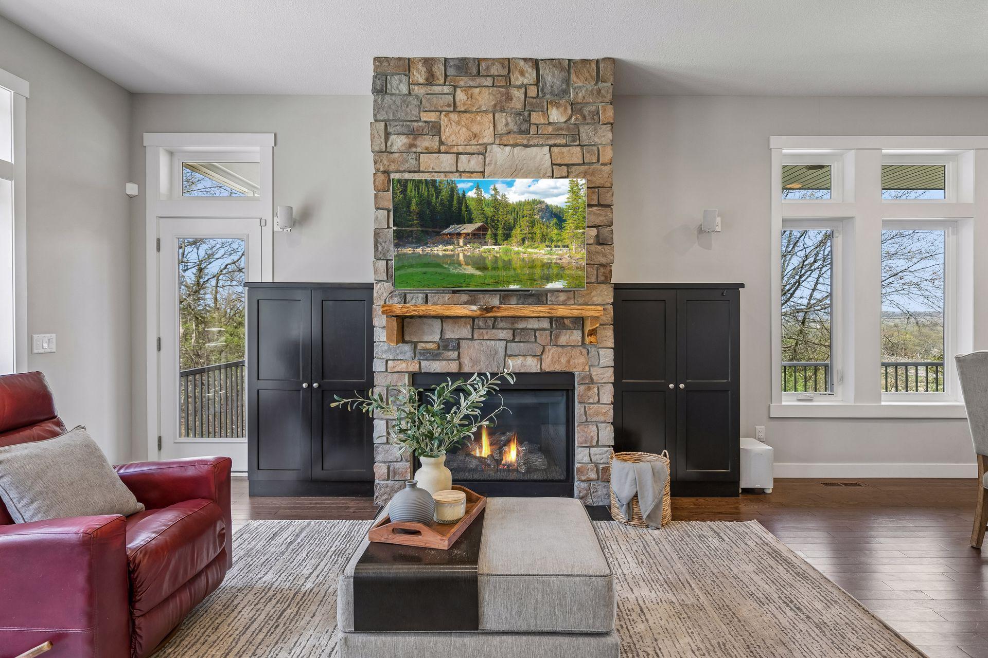 Handsome, functional built-ins flank the stone fireplace.