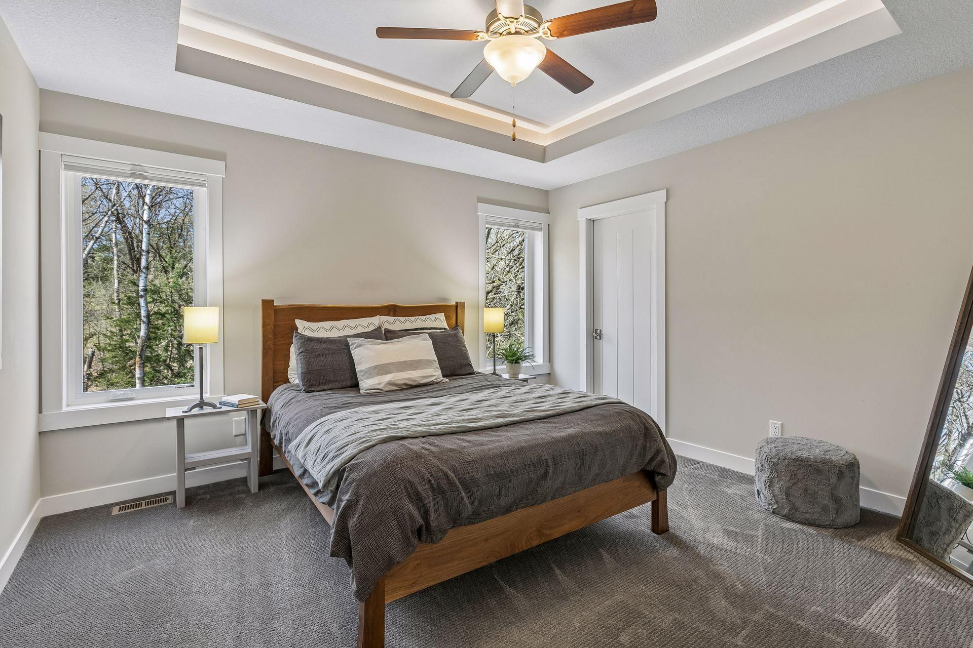 This is the 3rd bedroom on the upper level with a walk-in closet - also offering a tray ceiling & the adjustable Hue lighting.