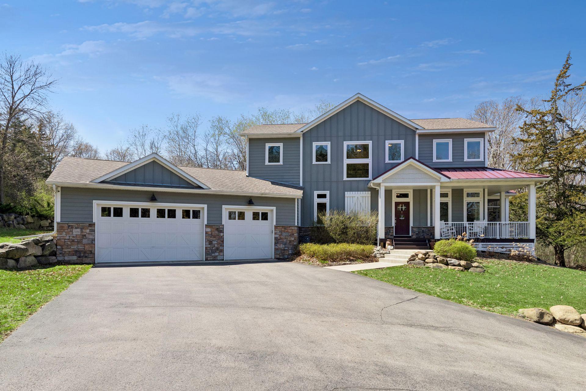This modern farmhouse has an extra long driveway & pad offering plenty of parking for guests.
