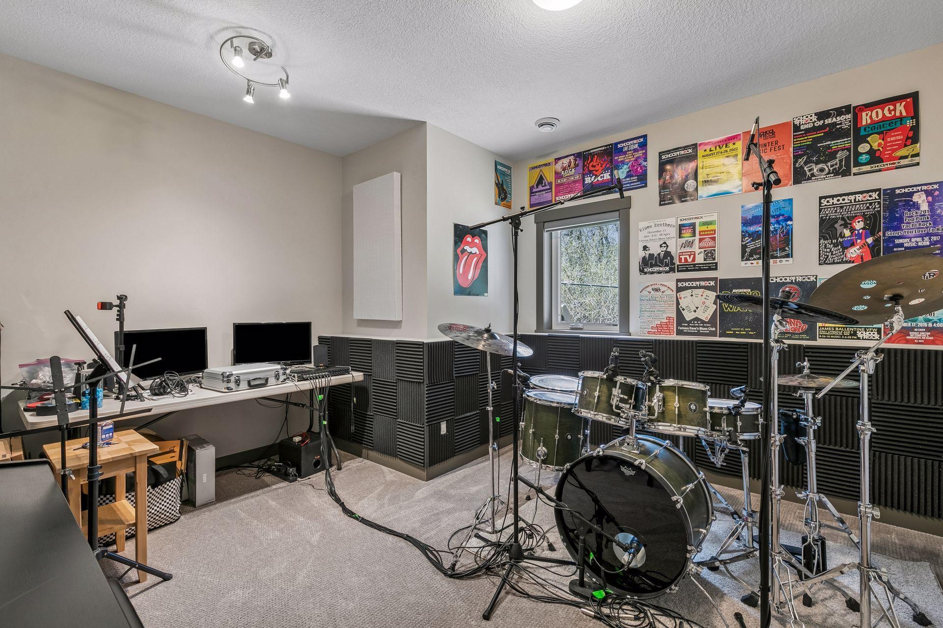 Flex room in the lower level currently being used as a music studio.