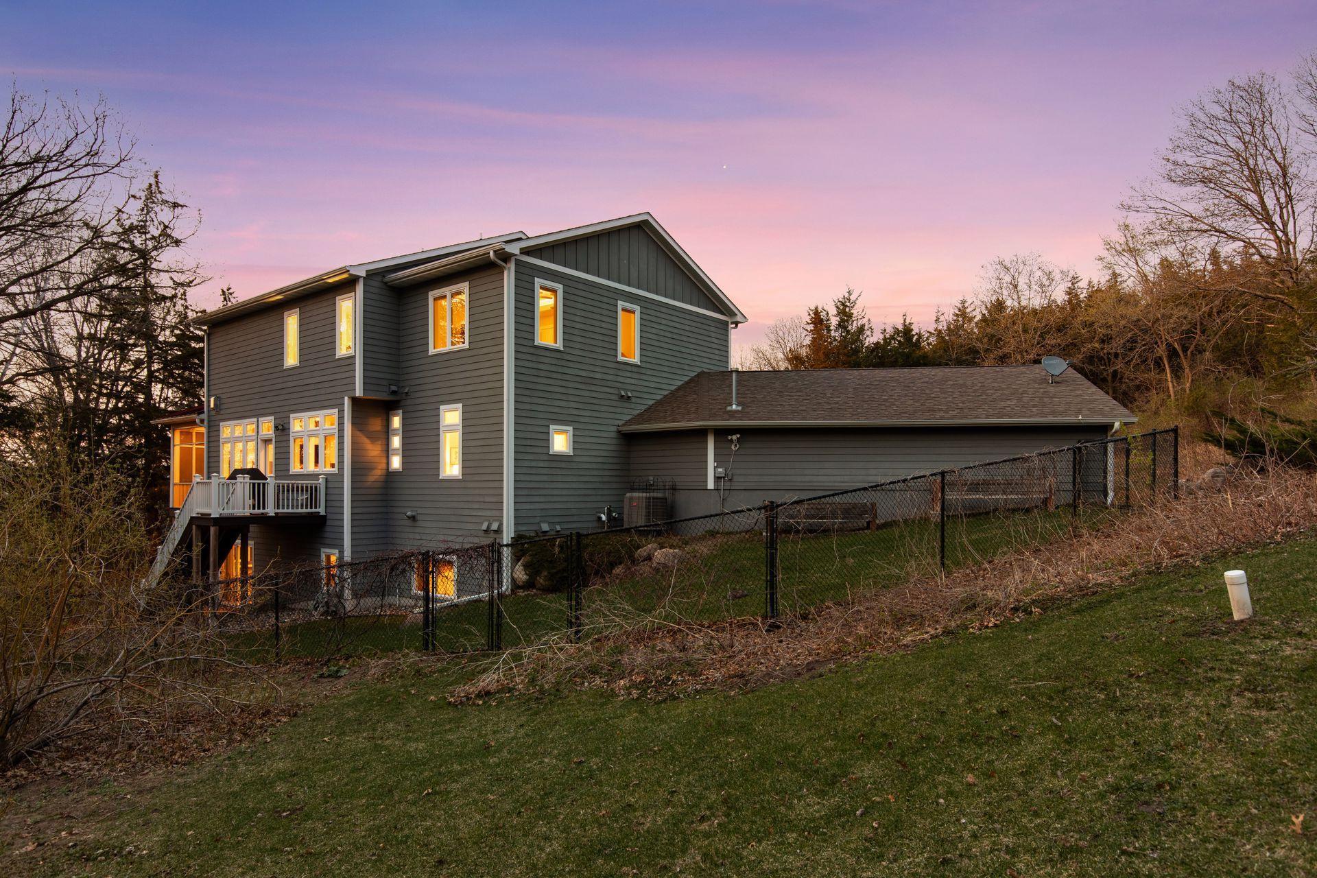 A chainlink fence surrounds the backyard.