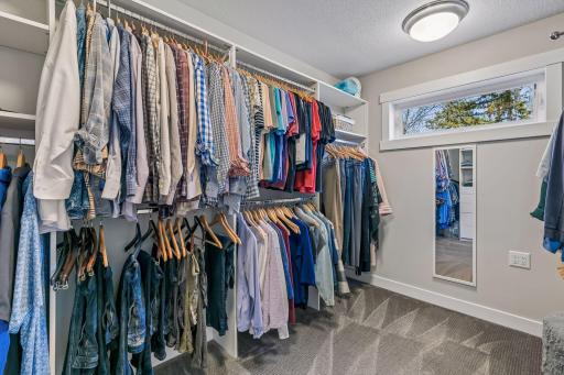A generously sized walk-in closet completes this Owner's Suite!