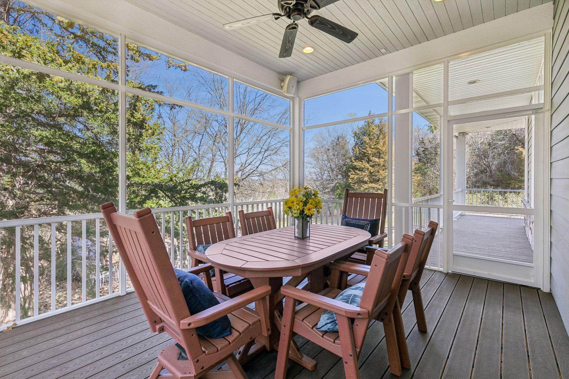 Just in time for summer, this screened porch offers maintenance free decking, speakers, ceiling fan & amazing nature views! Here you can also see that it connects to the wraparound deck.