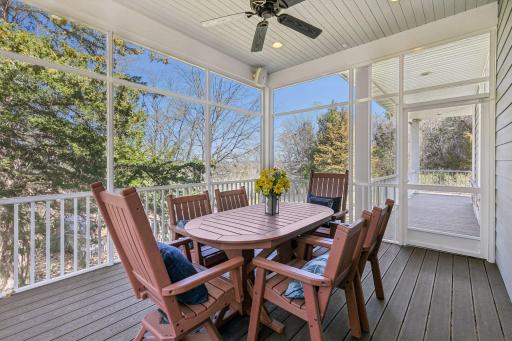 Just in time for summer, this screened porch offers maintenance free decking, speakers, ceiling fan & amazing nature views! Here you can also see that it connects to the wraparound deck.