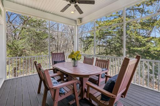 Surrounded by beauty, this screened porch is soon to be your new favorite place for morning coffe or dinners!
