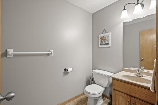 Convenient main level half bath located just off the kitchen and garage entry.