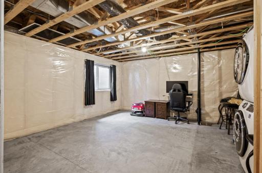 Unfinished basement family room, additional bedroom, build equity and finish for your needs.