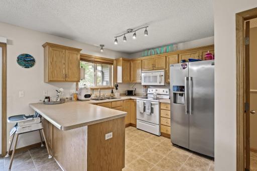 Functional kitchen layout with center island, ample counter space, and natural light â perfect for everyday living and entertaining.