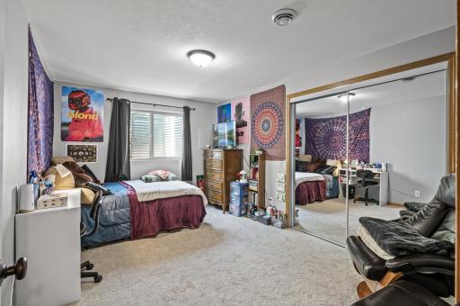 Finished lower level bedroom offering additional living space perfect for guests, workout room, or flex space.