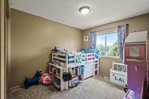 Third upper level bedroom with great natural light and neutral finishes.