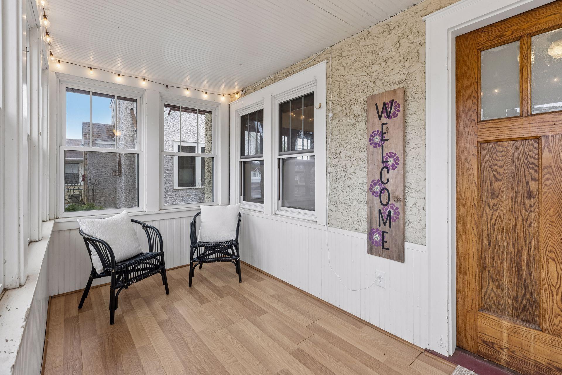 The front porch is a charming area to welcome guests.