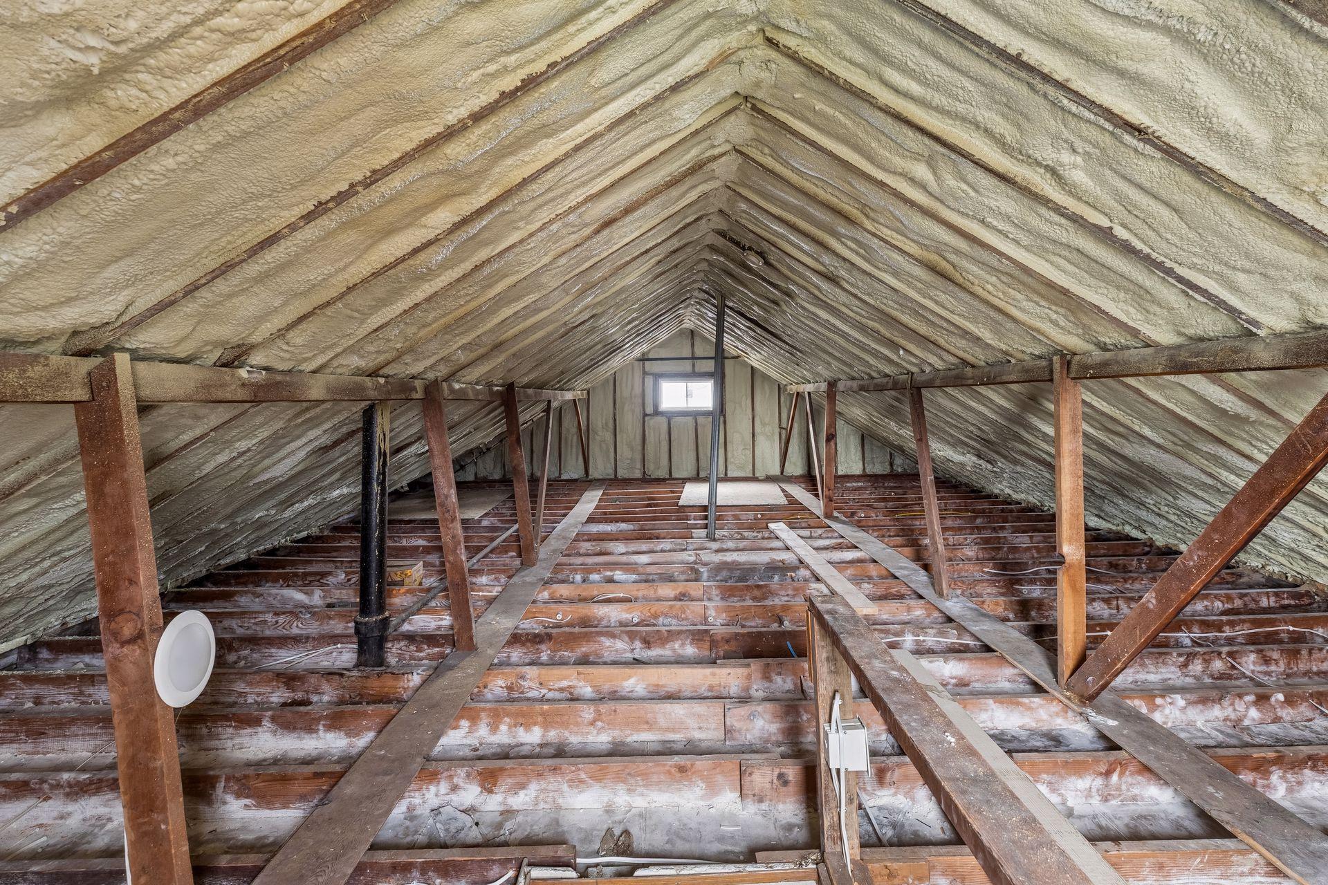Here is the upstairs unfinished space. It has been recently insulated with spray foam and is ready for the next steps to be finished.