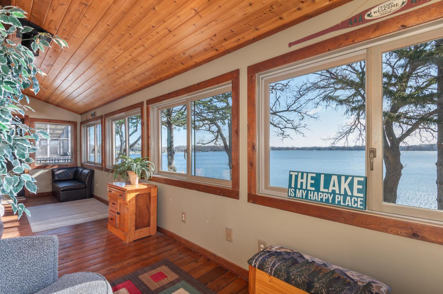 The 3 season porch offers incredible sunrise views over Cooks Bay of Lake Minnetonka! A great place for a morning cup of coffee.