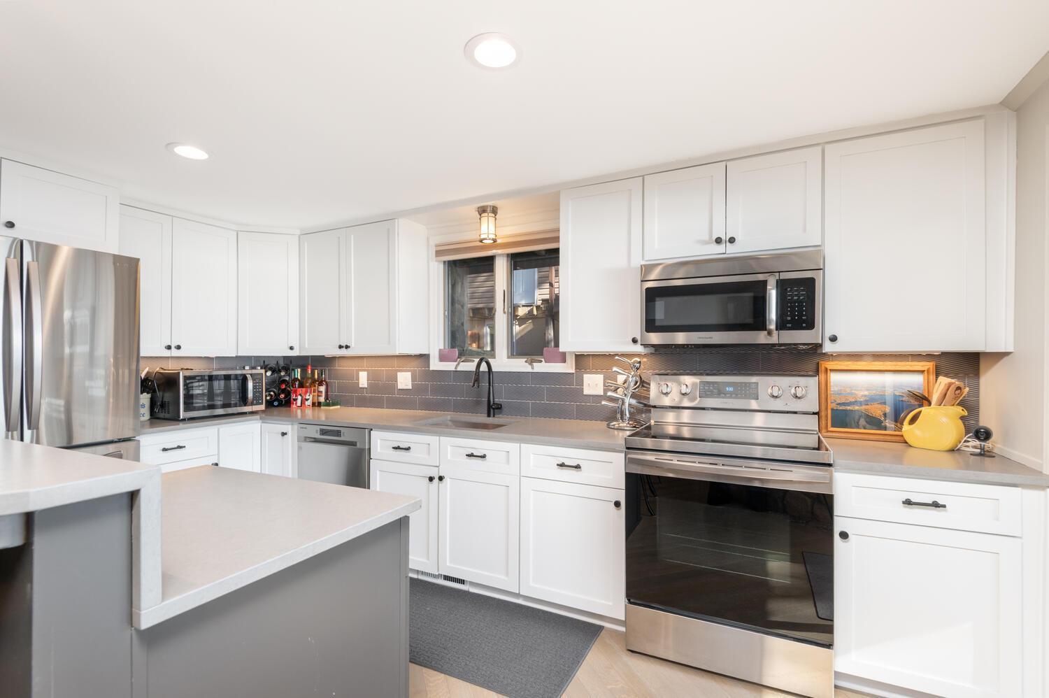 A photo of the bright new kitchen remodel. Incredible view of the lake from here too!