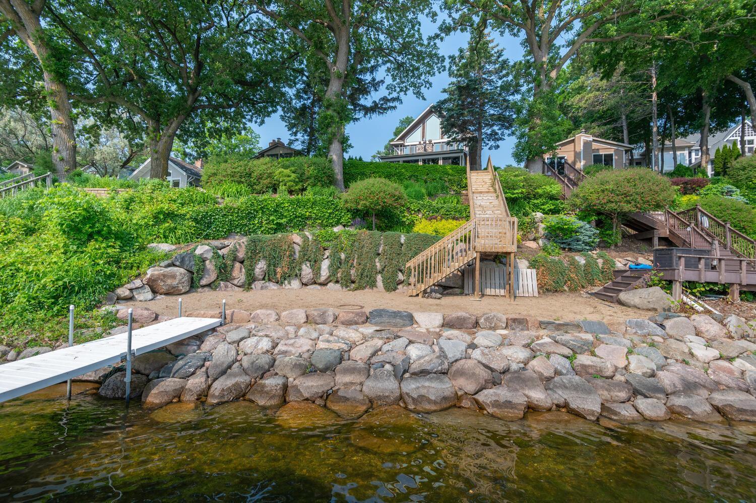 Wonderful sandy area and great water quality! Beautiful terraced boulder walls and perennial gardens provide great lake side appeal.