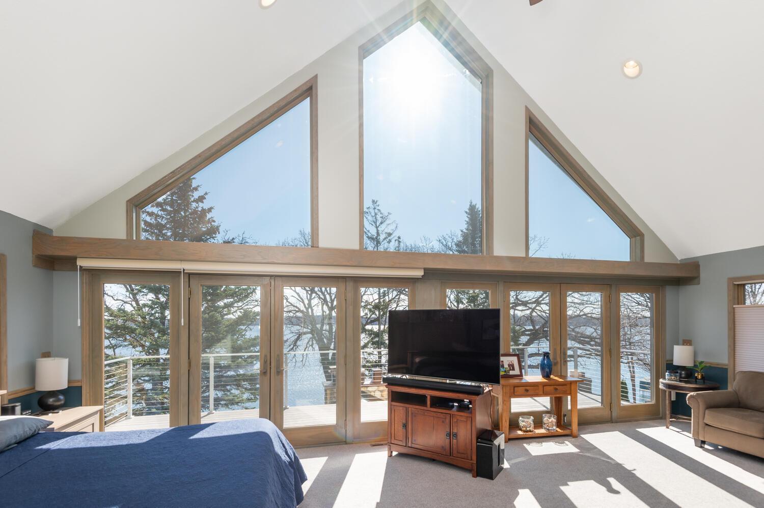 Incredible 27 foot wide primary bedroom with sitting area! Andersen doors step out to the new deck with 180 degree views.