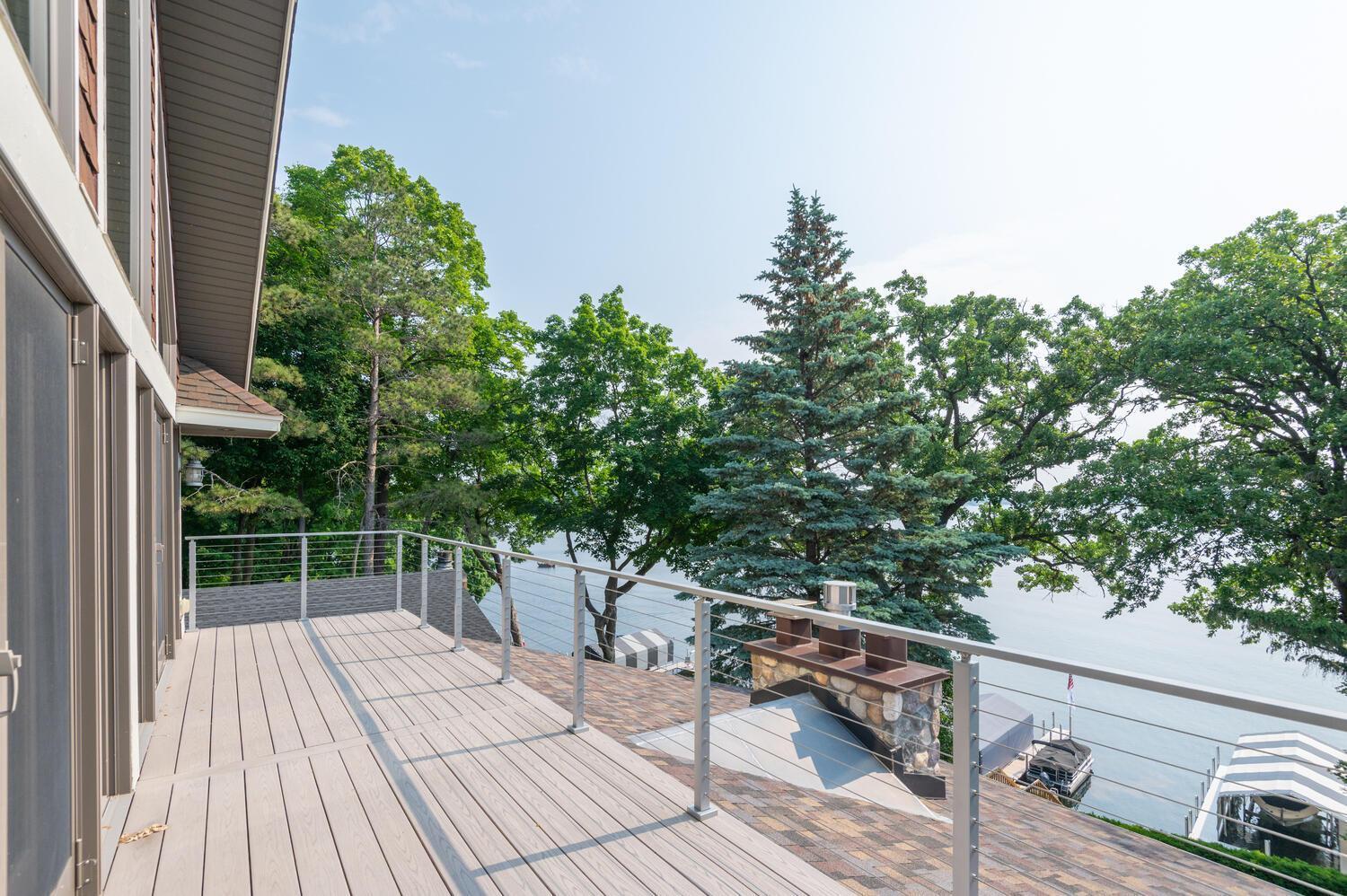 Enjoy the breathtaking views from the new maintenance free deck with cable railing!