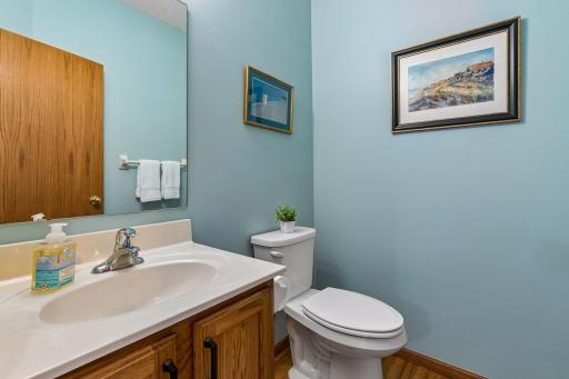 Convenient main-level half bathroom with updated hardware and fresh, clean finishes.