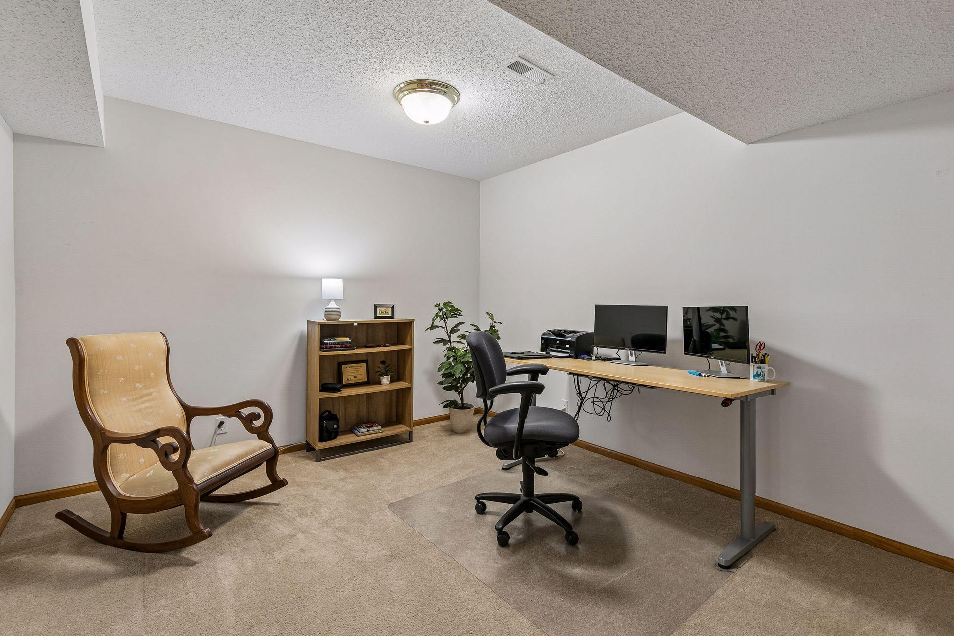 Flexible lower-level office or hobby room ideal for working from home, exercise space, gaming, or creative projects.