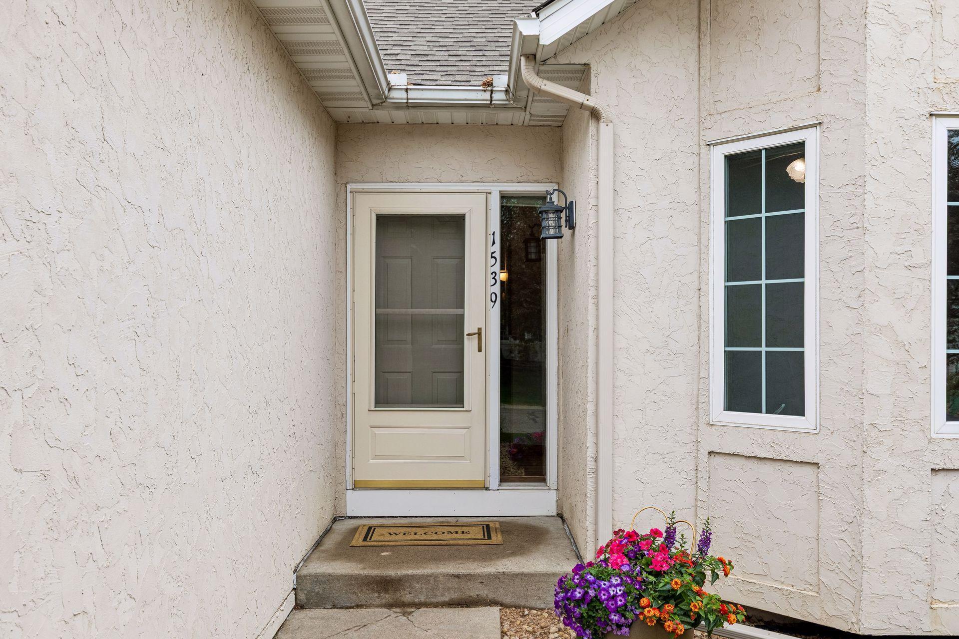 Inviting front entry welcomes you into this well-maintained twin home featuring low-maintenance living, mature landscaping, and a quiet residential setting near parks, shopping and easy Twin Cities access.