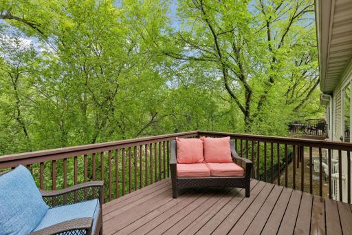Private deck with peaceful wooded views and exceptional backyard privacy. A perfect outdoor retreat for relaxing, entertaining, or enjoying nature in this desirable Eagan twin home community.
