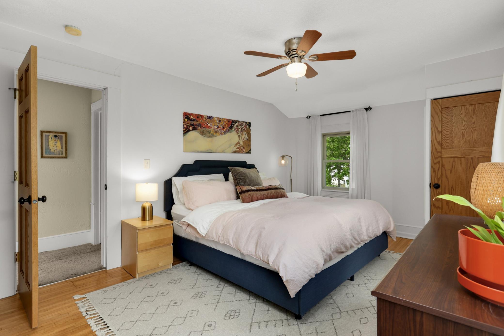 A massively sized primary includes three closets...yes, and a king size bed here!