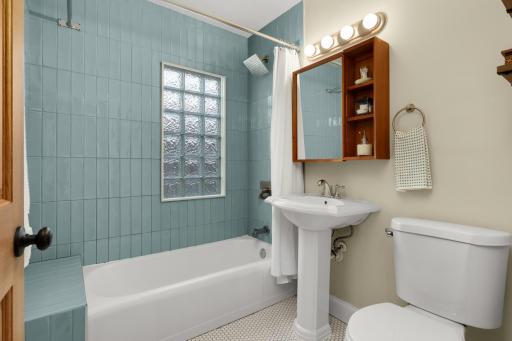 Who doesn't love a fresh bathroom with new vintage inspired tile flooring, combined with tiled shower bench for modern day shaving?