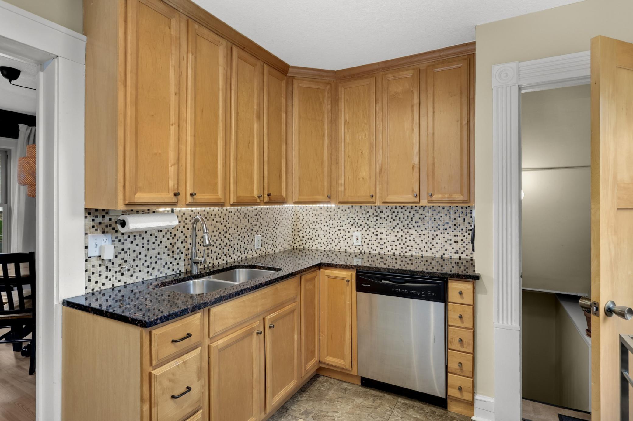 The heart of home is situated centrally between the dining/living and access to the back yard for indoor/outdoor convenience.