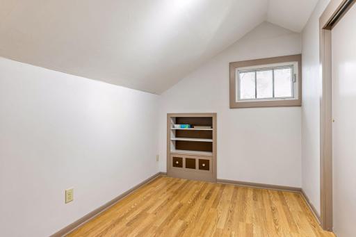 The upper-level fourth bedroom offers a generous closet and an adorable built-in