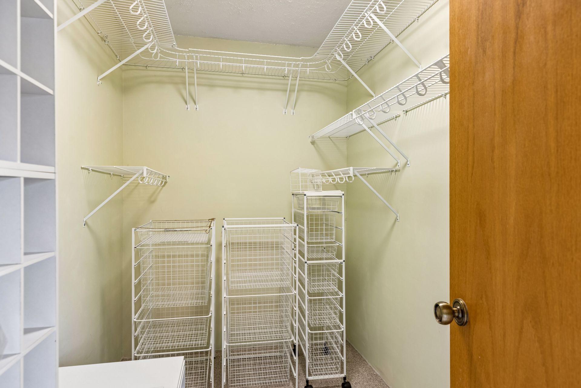 Primary closet with built ins & shelving