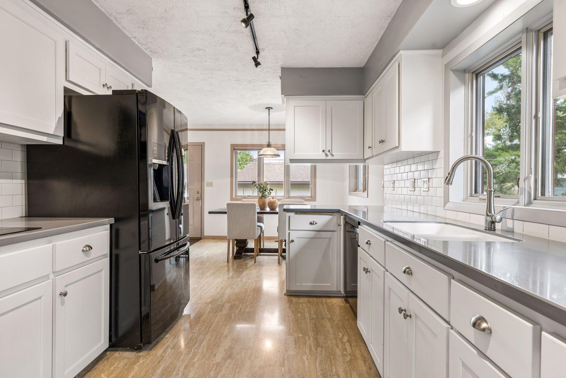 The addition extended the kitchen to include an informal dining area & great room.