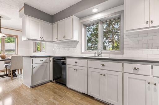 Remodeled in 2016 offers a ton of cabinets & counterspace. Classic tile backsplash & Corian countertops.