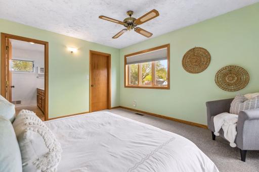 A bright sun filled bedroom with east & south windows.