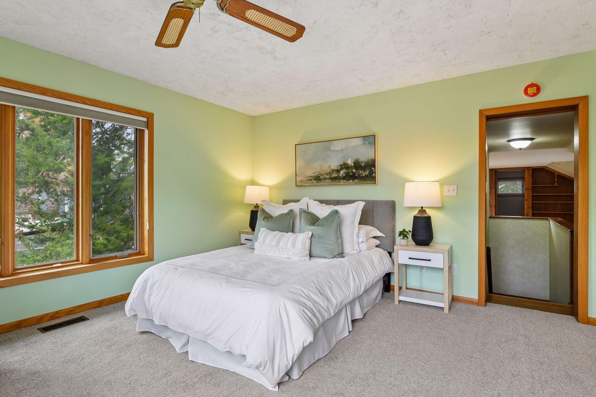 The spacious primary suite offers a walk-in closet and a private ¾ bath