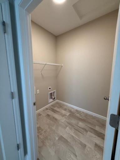 Spacious and well-organized laundry room designed for everyday ease, featuring ample space for folding, sorting, and storage.
