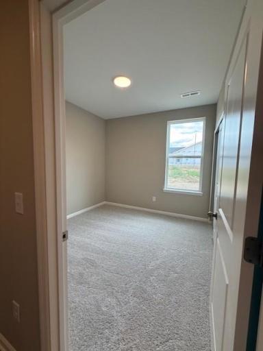 Flexible in its use, this guest bedroom can easily serve as a cozy retreat, home office, or additional sleeping space as needed.