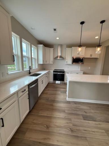 Bright and spacious kitchen featuring ample cabinetry, sleek countertops, and a functional layout—perfect for everyday living and entertaining.