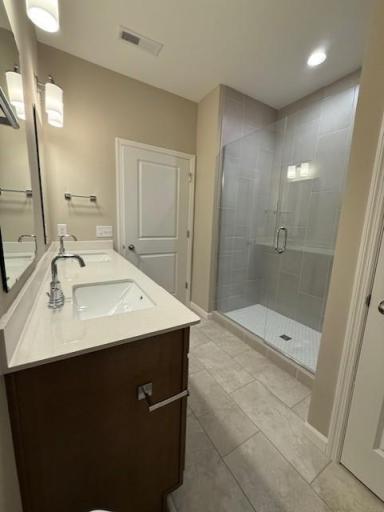 Beautifully designed primary ensuite bathroom offering a private, spa-like retreat complete with a spacious layout and high-end finishes.