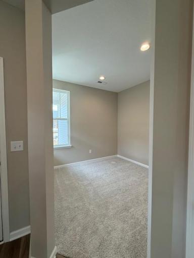 Spacious and sunlit flex room ready for your personal touch—ideal for a home office, studio, playroom, or guest accommodations.