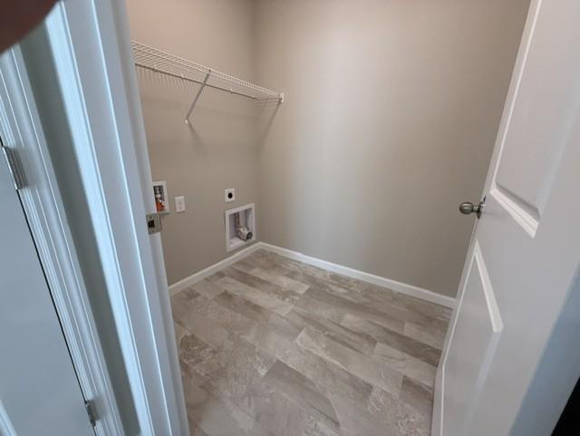 Spacious and well-organized laundry room designed for everyday ease, featuring ample space for folding, sorting, and storage.