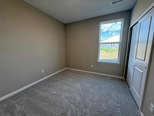 Flexible in its use, this guest bedroom can easily serve as a cozy retreat, home office, or additional sleeping space as needed.