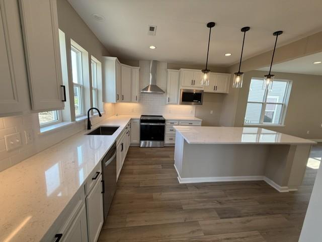 Bright and spacious kitchen featuring ample cabinetry, sleek countertops, and a functional layout—perfect for everyday living and entertaining.