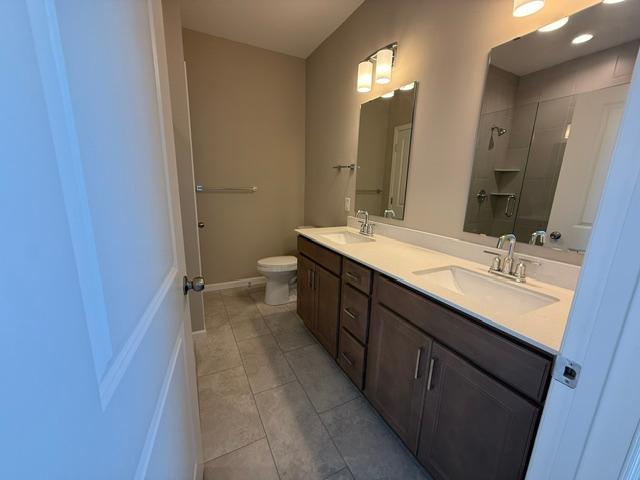 Double vanity with sleek countertops and ample storage provides both function and style—perfect for shared use while maintaining personal space.