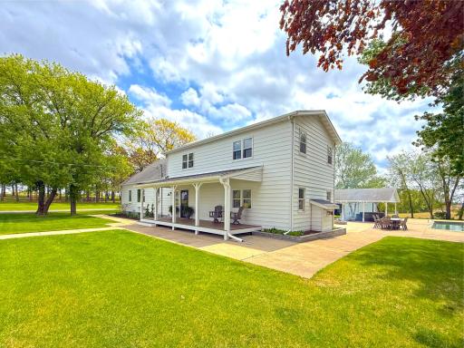 The grounds feature an abundance of fruit trees and beautiful gardens, adding both charm and productivity to the setting.