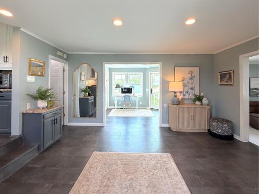 As you enter the foyer from the front porch, a large coat closet, recessed lighting and white trim throughout finishes off the foyer.