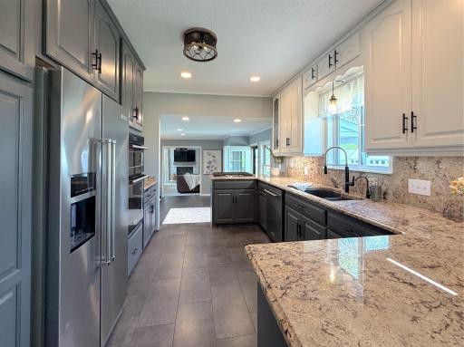 Cooking and entertaining made easy with wonderful prep space, while the window above the sink fills the kitchen with natural light.