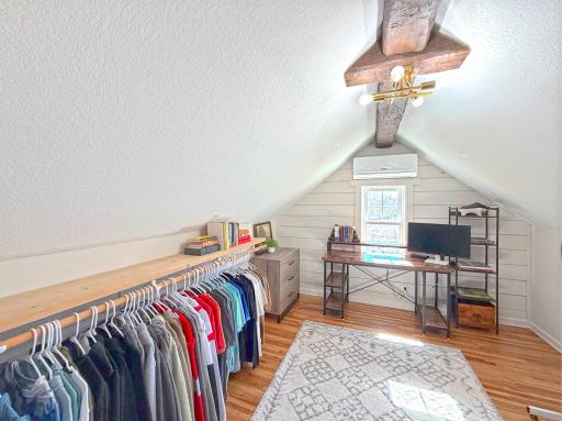 This versatile upper-level flex room is currently used as an oversized walk-in closet but could easily serve a variety of purposes.